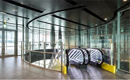 Glass entrance and escalators at Shibuya Stream